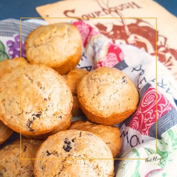 whole wheat sourdough muffins in a basket