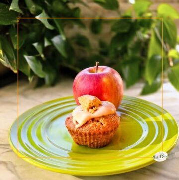 apple cupcake on a plate with an apple