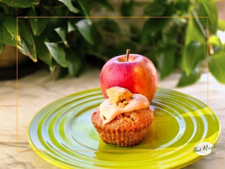 apple cupcake on a plate with an apple