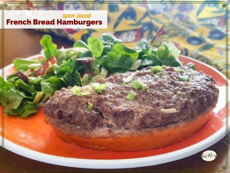 open faced burger on a plate with a green salad and text overlay "Open Faced French Bread Hamburger"