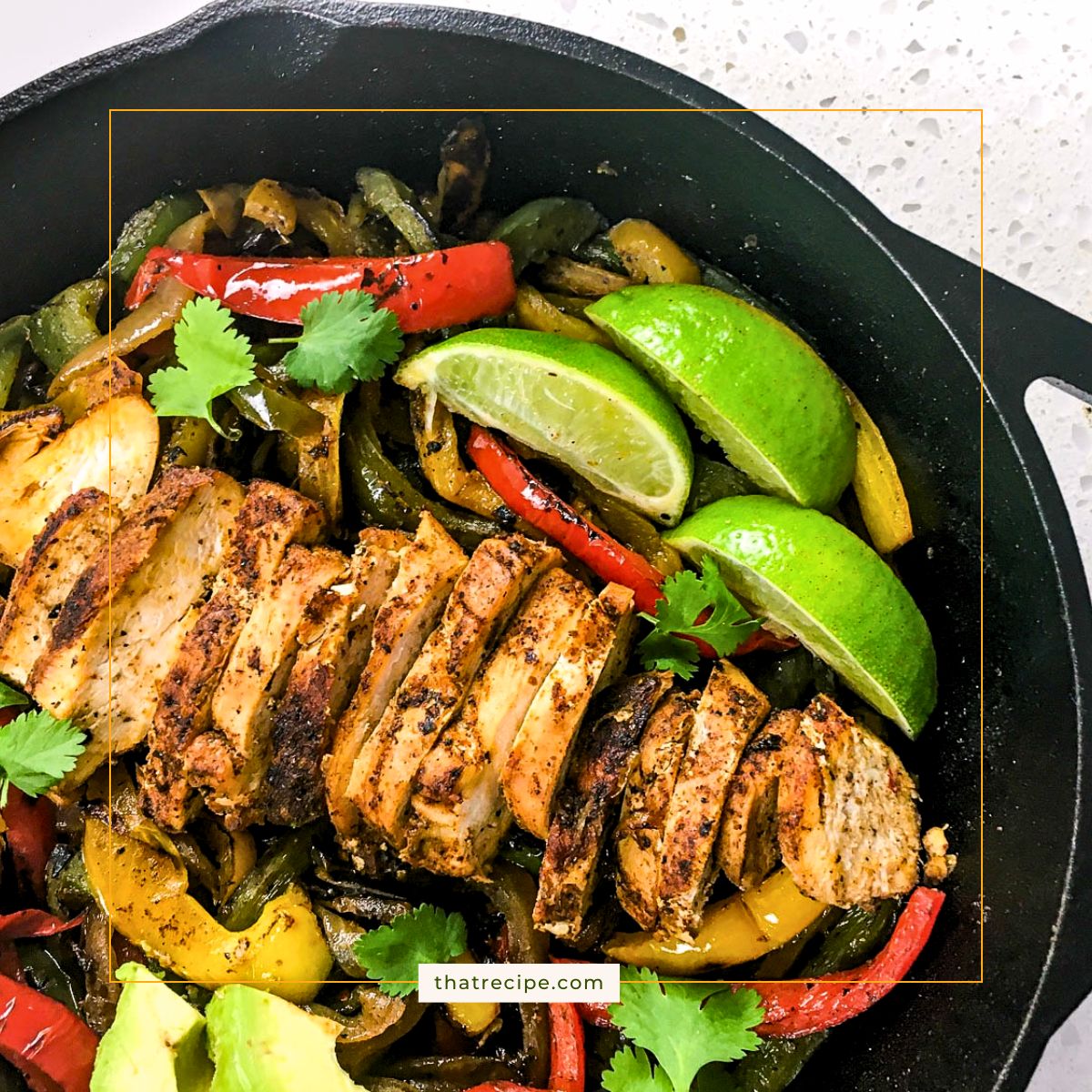sliced chicken breast and vegetables in a cast iron skillet