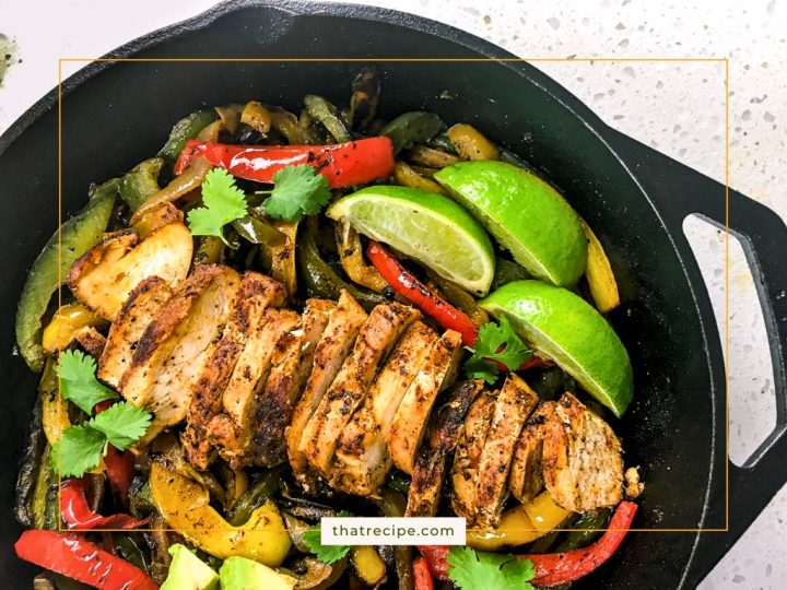 sliced chicken breast and vegetables in a cast iron skillet