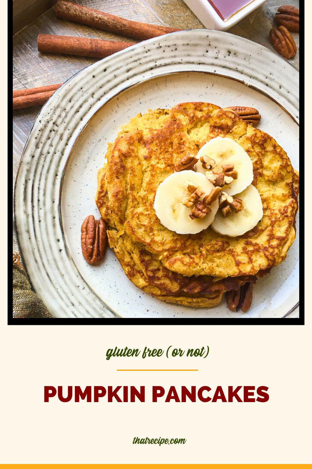 top down view of pancakes on a plate topped with pecans and banana slices and text overlay "gluten free pumpkin pancakes"