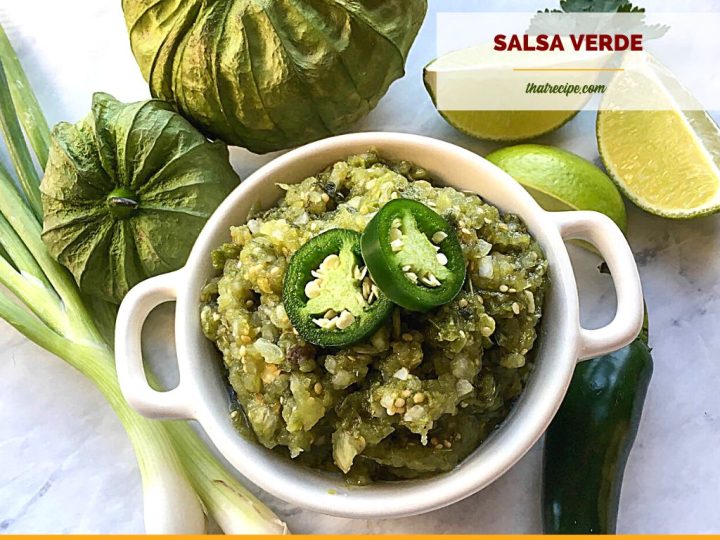 bowl of salsa verde with limes, tomatillos, peppers and onions surrounding it and text overlay "fresh homemade salsa verde"