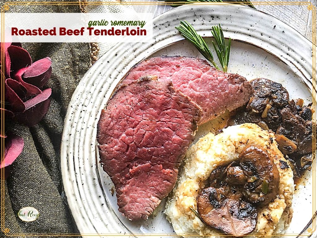 top down view of slice of beef with potatoes and mushrooms on a plate with text overlay "rosemary and garlic roasted beef tenderloin"