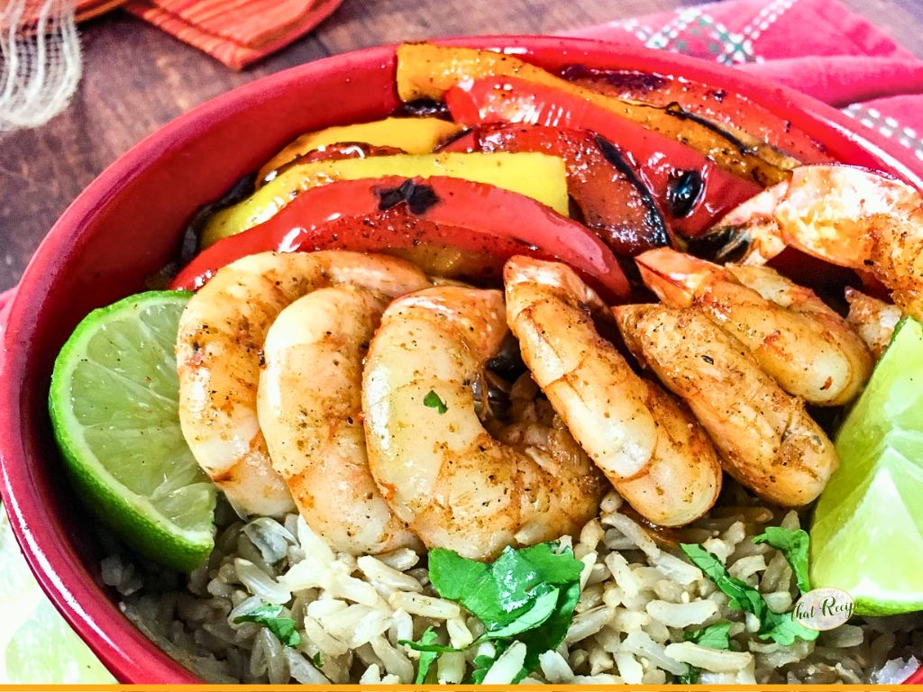 top down view of shrimp and rice bowl with text overlay "cuick - easy - healthy Shrimp Fajita Bowls"