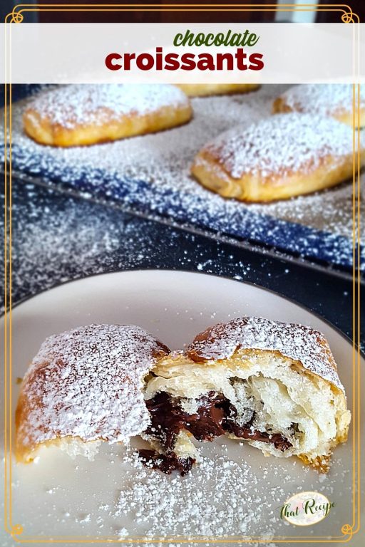 Chocolate croissant broken open on a plate