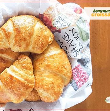 top down view of croissants in a basket with text overlay "homemade croissants"