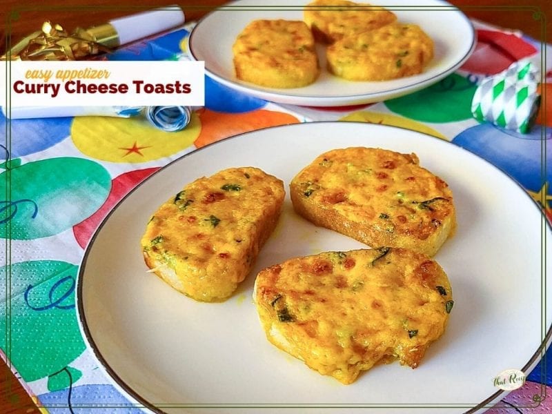 mini cheese appetizers on a plate with text overlay "Curry Cheese Toasts"