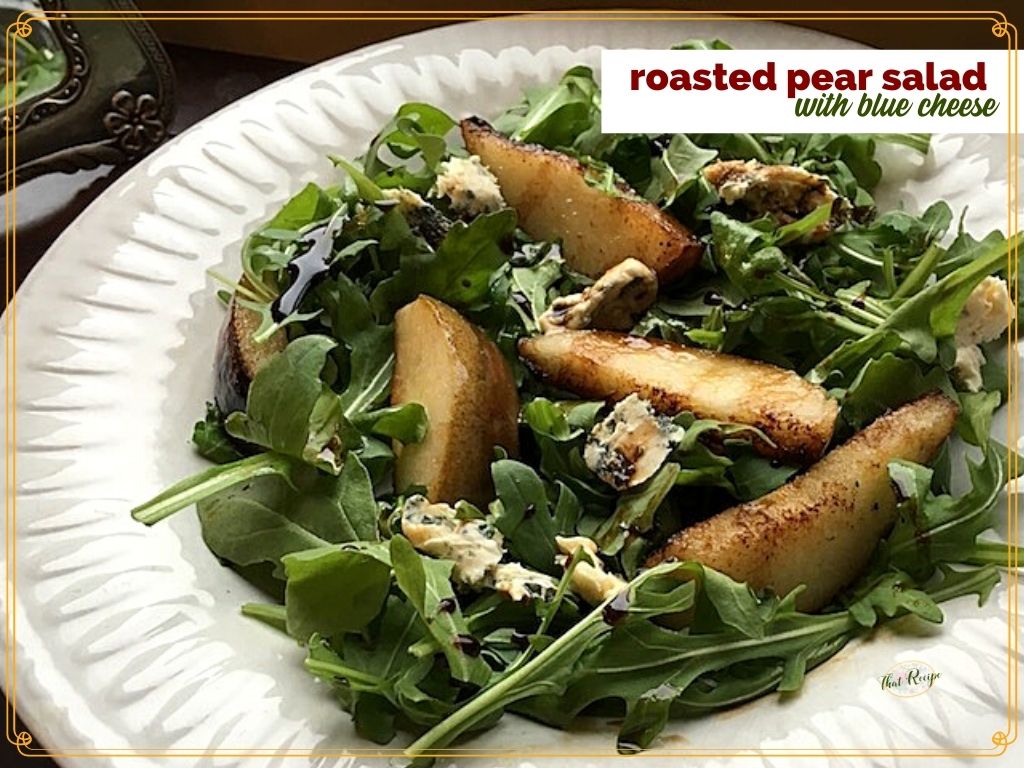 roasted pears on arugula with text overlay "roasted Pear Salad with blue cheese"