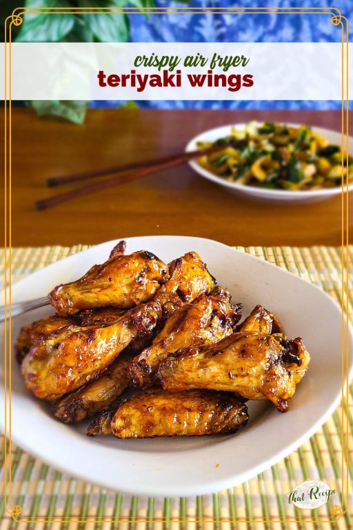 glazed chicken wings on a plate with text overlay "air fryer teriyaki chicken wings"