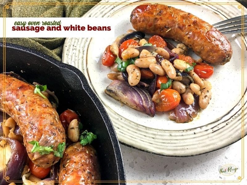 sausage and white bean medley on a plate with cast iron skillet in the foreground and text overlay "easy roasted sausage and white beans"a
