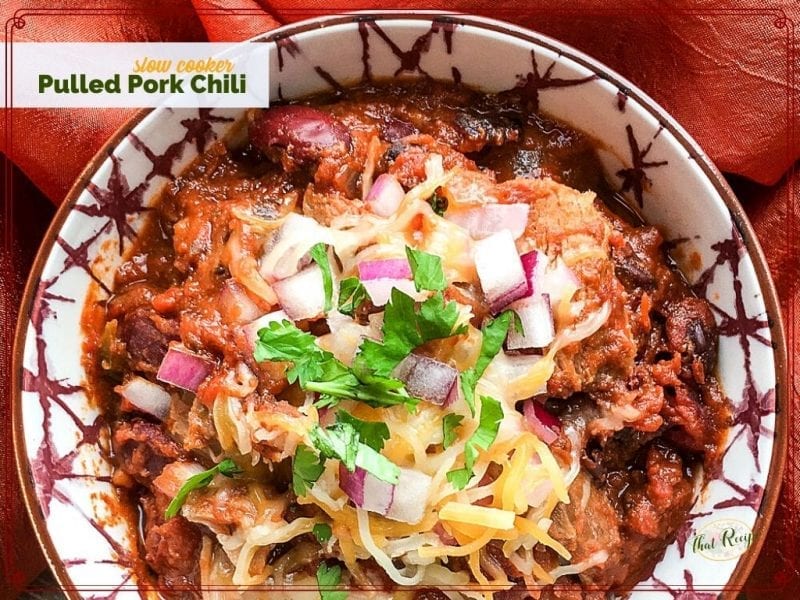 top down view of bowl of chili "Slow Cooker Pulled Pork Chili"
