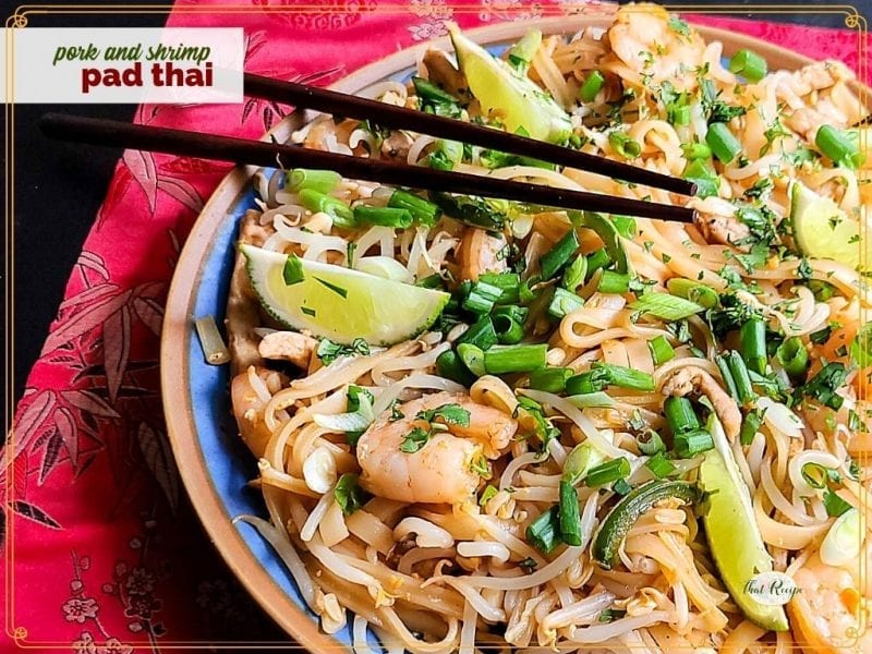 top down view of noodles with shrimp and text overlay "pork and shrimp pad thai"