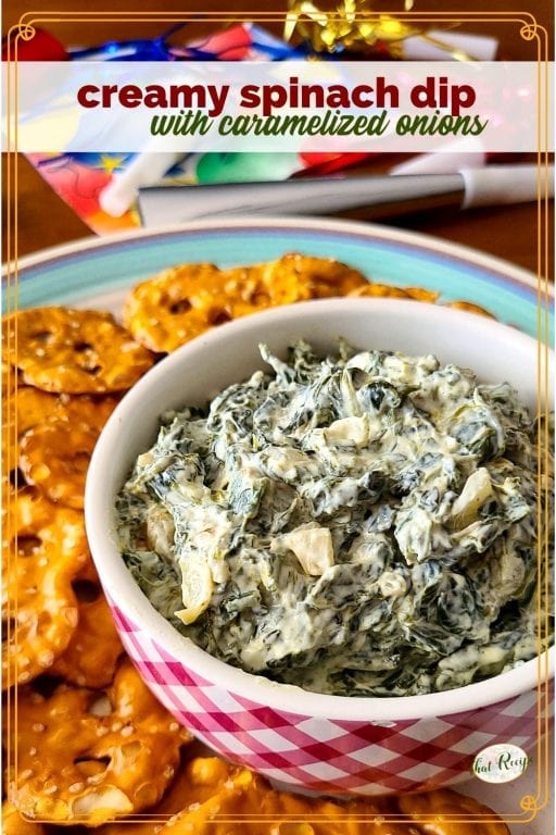 spinach dip in a bowl with pretzel crackers around it and text overlay "creamy spinach dip with caramelized onions"