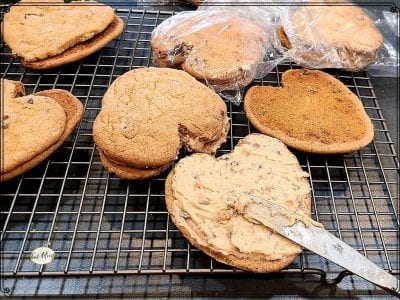 heart shaped cookies spread with brown sugar frosting