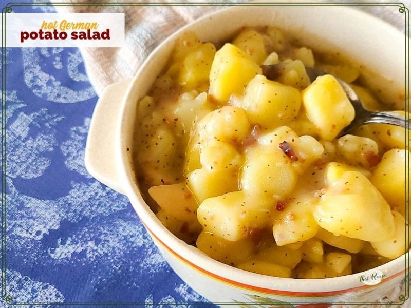 potatoes with bacon in a dish with text overlay "Hot German Potato Salad"