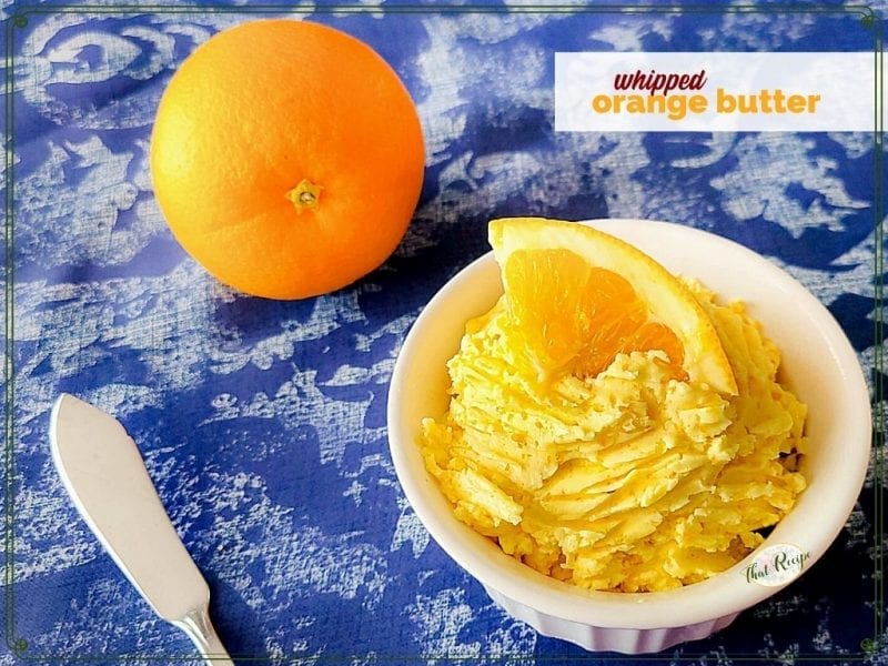 orange butter in a dish with text overlay "whipped orange butter"