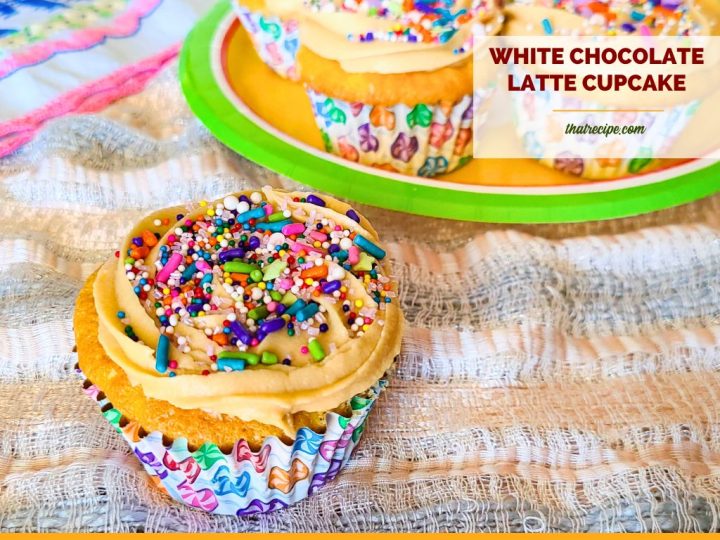 white chocolate cupcake with tan frosting and sprinkles