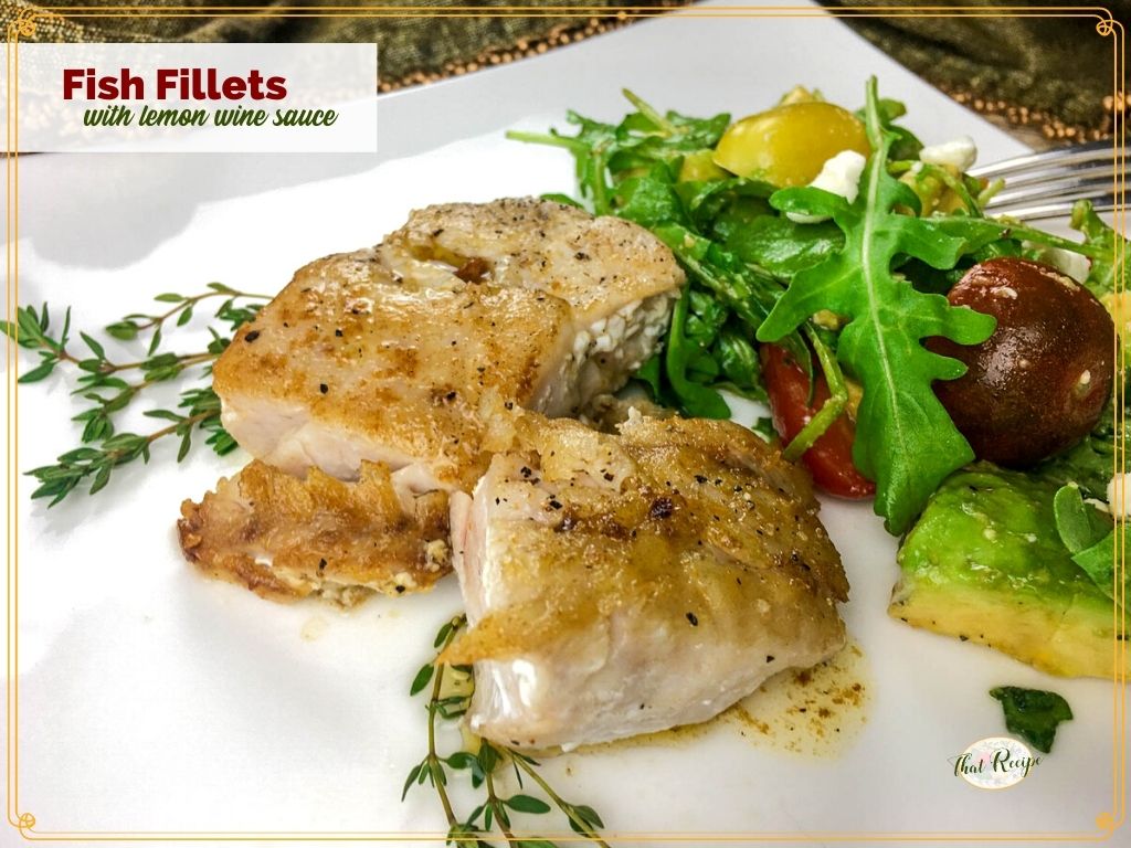 cooked fish fillet on a plate with text overlay "fish fillets with lemon wine sauce"