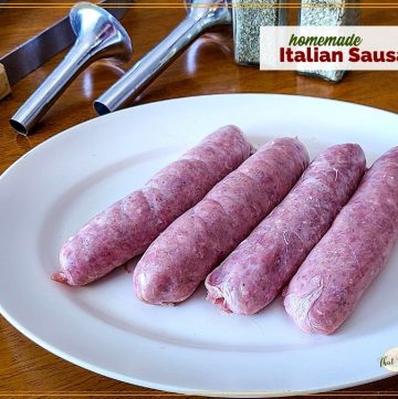 Homemade sausages on a plate with sausage making tools and herbs and text overlay "Homemade Italian Sausages"