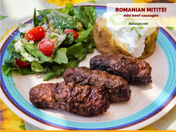 grilled beef sausages on a plate with text Romanian Mititei