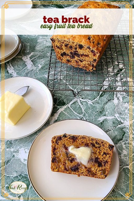 loaf of fruit bread on a cooling rack with text overlay "Tea Brack, easy fruit tea bread"