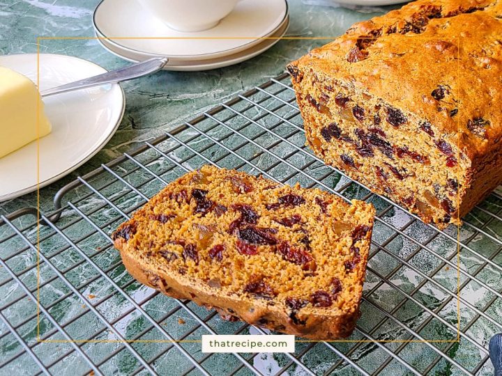 loaf of Tea Brack, a fruit studded quick bread on a cooling rack