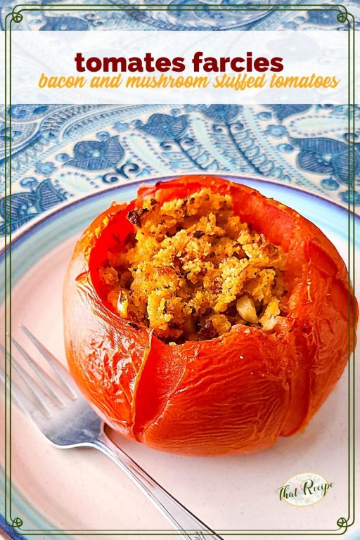 stuffed tomato on a plate with text overlay "tomates farcies"
