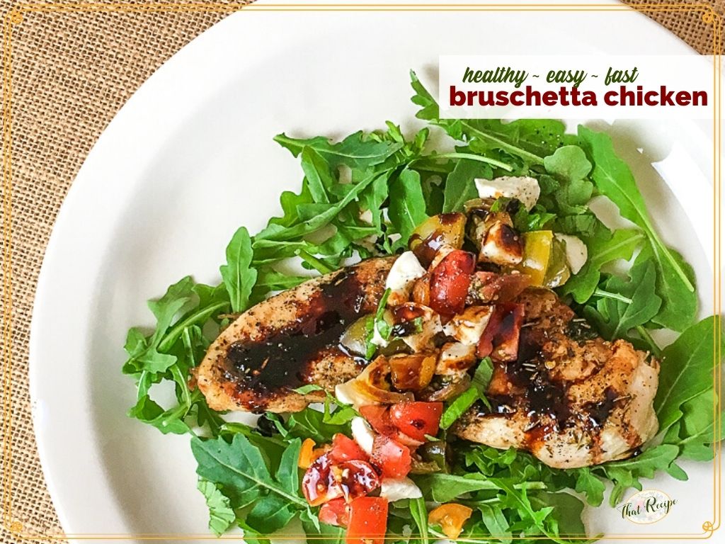 chicken breast on a bed of arugula with text overlay "healthy wast fast bruschetta chicken"