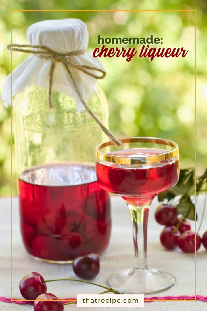 cherry liqueur in a cup and a bottle