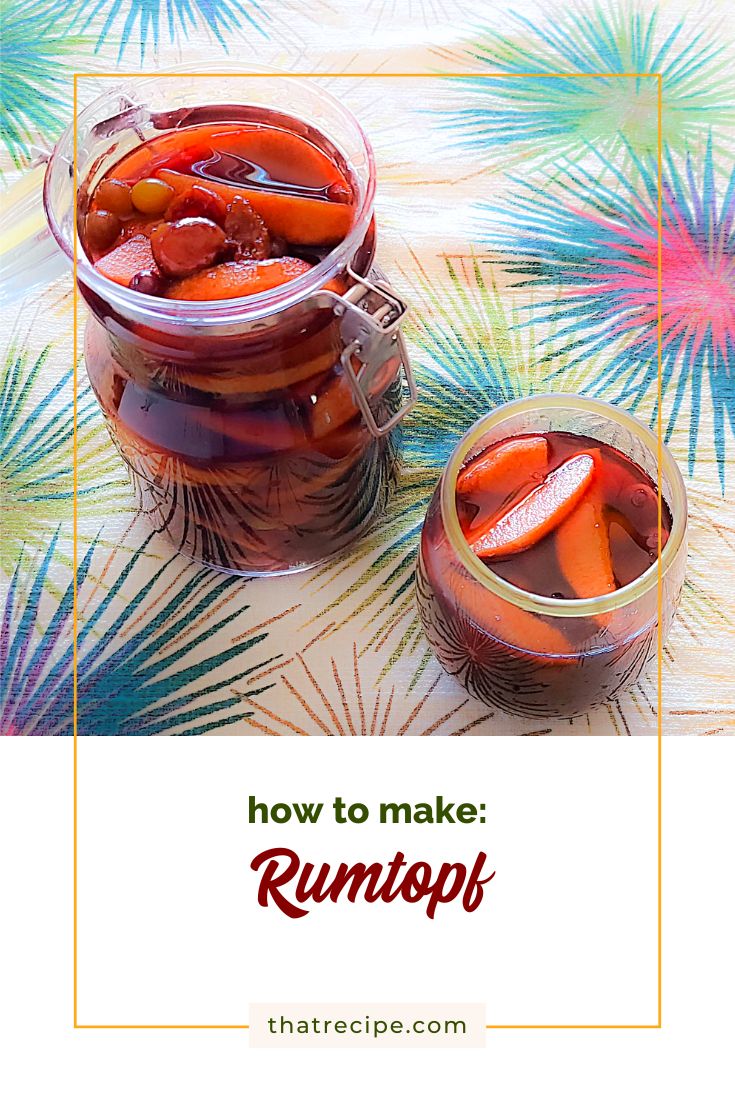 top down view of rum covered fruit in a jar and a glass