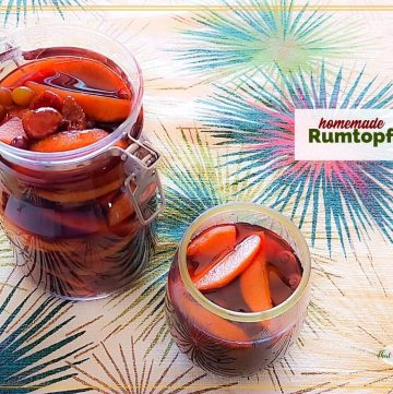 fruit in a jar and a glass covered in rum with text overlay "homemade Rumtopf"