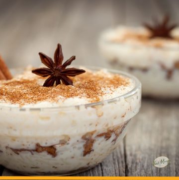 rice pudding in a bowl topped with nuts with text overlay "rice pudding with cooked rice"