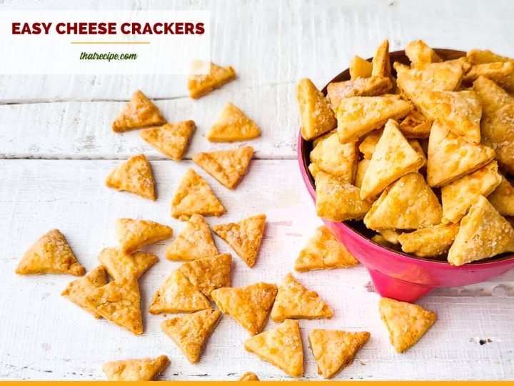 cheese crackers in a bowl and on a table with text overlay "homemade cheese crackers"