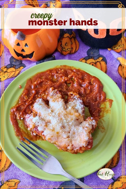 chicken breast cut into a hand on a plate of tomato sauce with text overlay "creepy monster hands" 