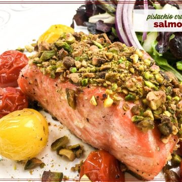 piece of salmon covered with chopped pistachios with text overlay "pistachio crusted salmon"