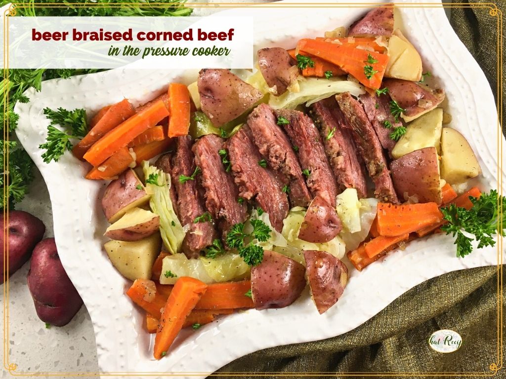 Slices of corned beef with vegetables and text overlay "beer braised corned beef in a pressure cooker"