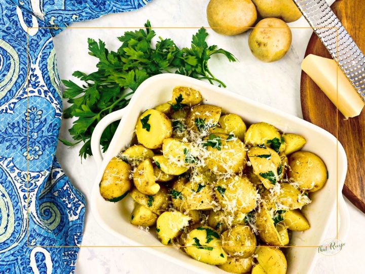 dish of baby potatoes with herbs and parmesan cheese