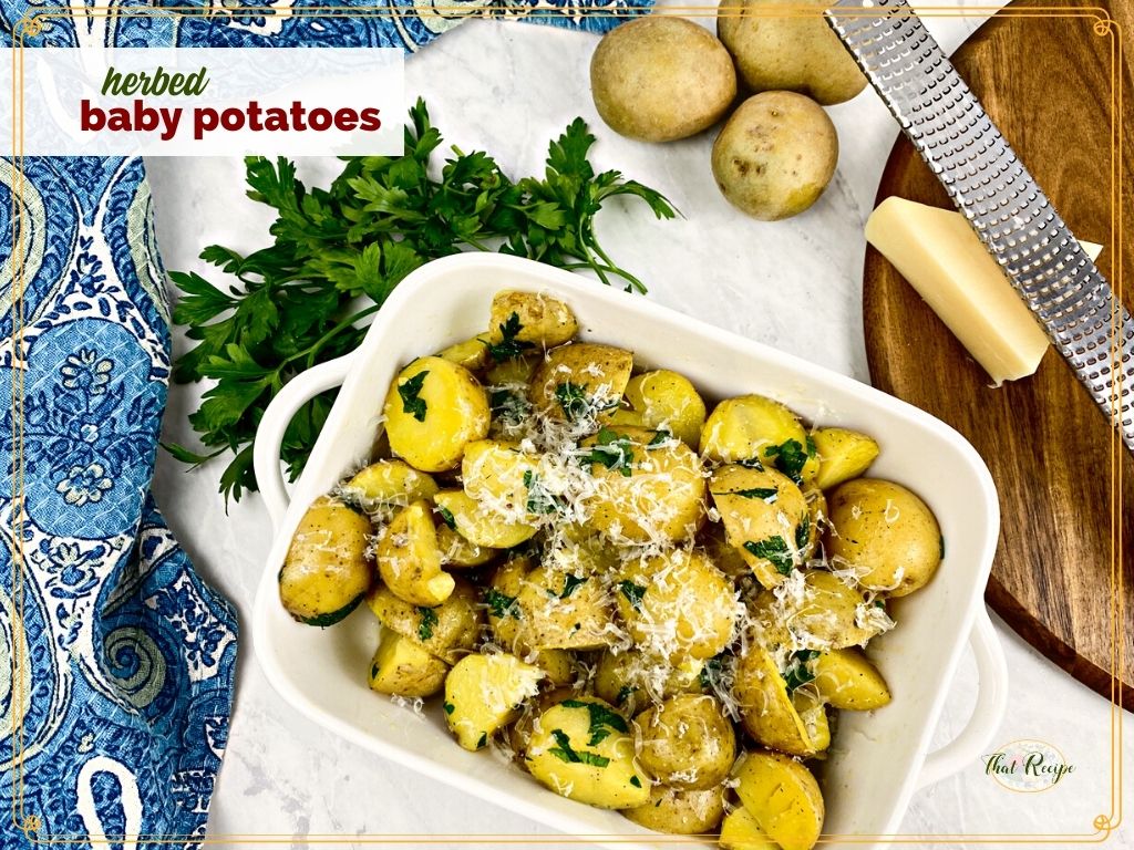 bowl of potato halves with text overlay "herbed baby potatoes"