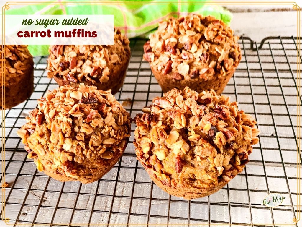 carrot muffins topped with granola on a cooling rack with text overlay "no sugar added carrot muffins"