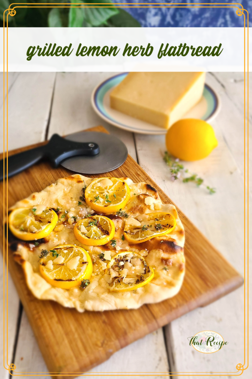 flatbread with grilled lemon slices and text overlay "grilled lemon herb flatbread"