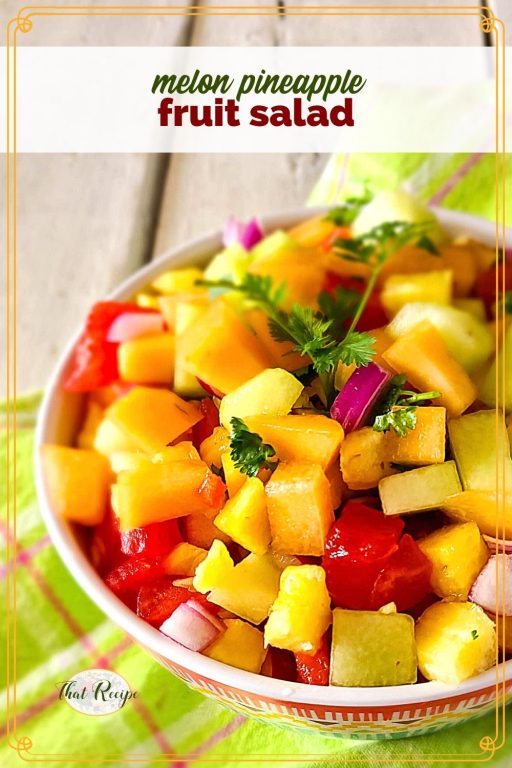 Fruit salad in a bowl with text overlay "Melon Pineapple Fruit Salad"