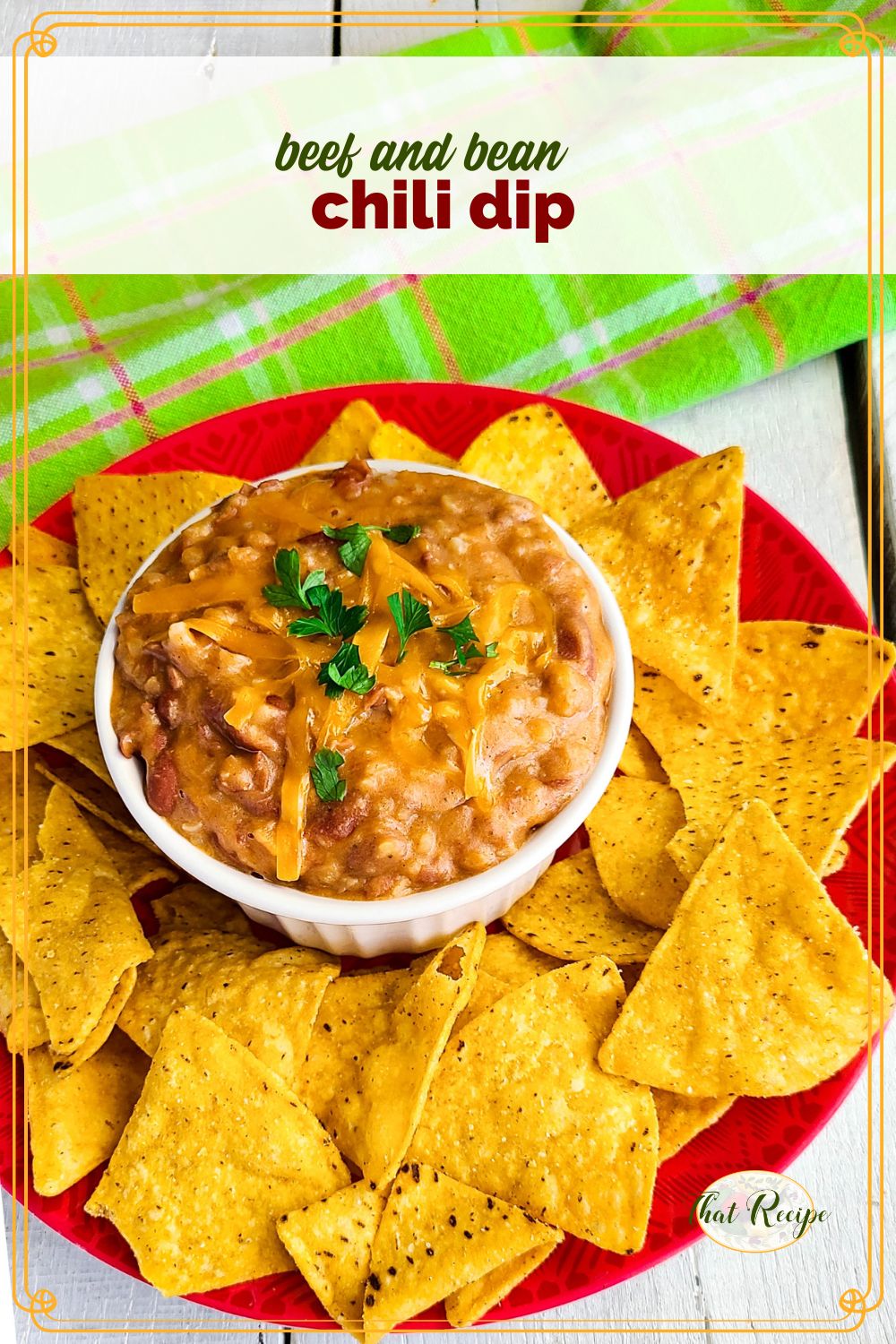 chili dip on a plate with chips and text overlay "beef and bean chili dip"