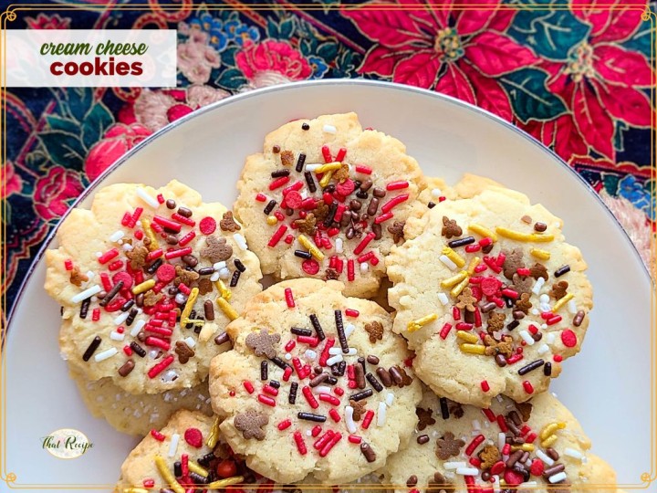 sprinkle cookies on a plate with text overlay "cream cheese cookies"