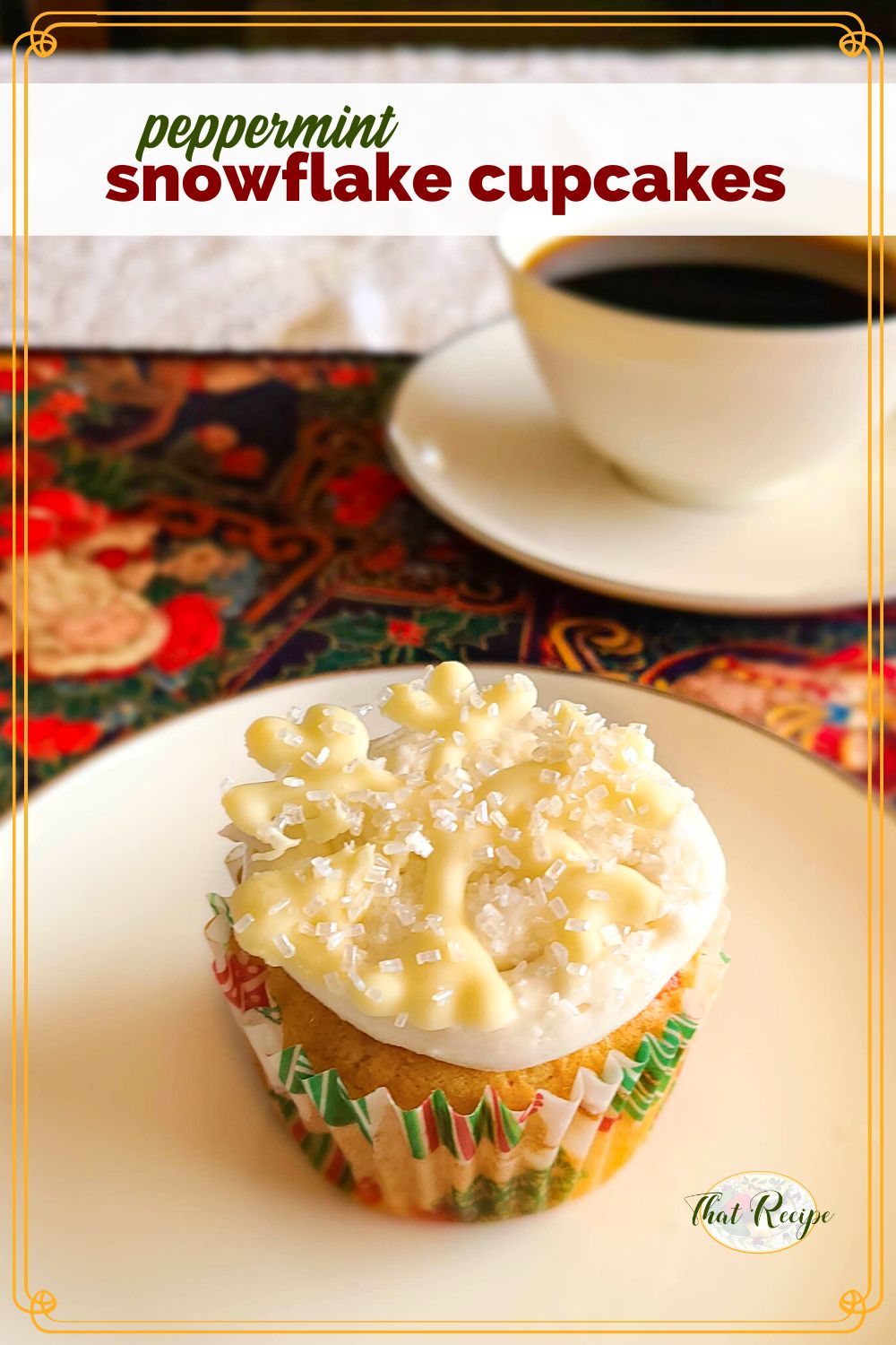 white cupcake on a plate with text overlay "peppermint snowflake cupcakes"