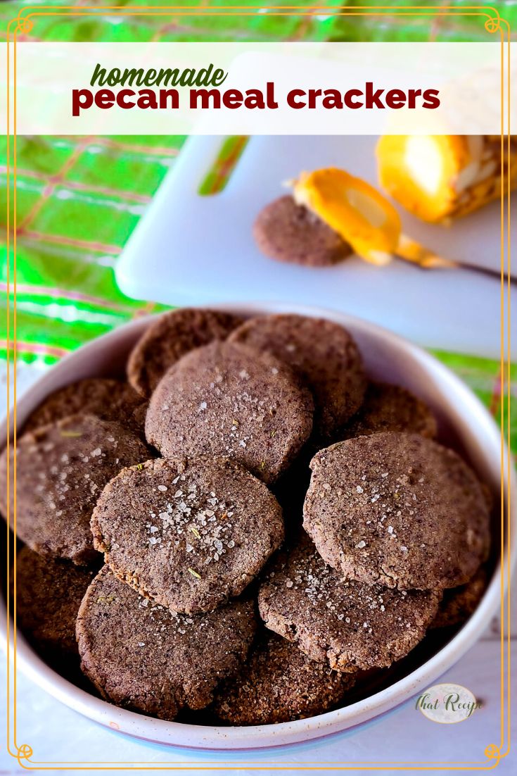 homemade crackers in a bowl with text overlay homemade pecan meal crackers