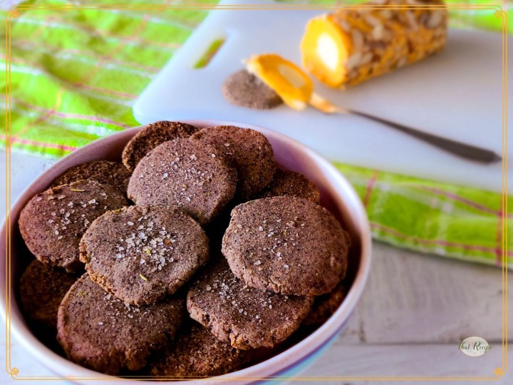 homemade crackers in a bowl with text overlay homemade pecan meal crackers