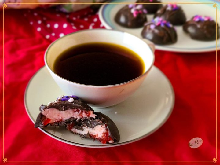 dark chocolate cherry truffle with cup of coffee