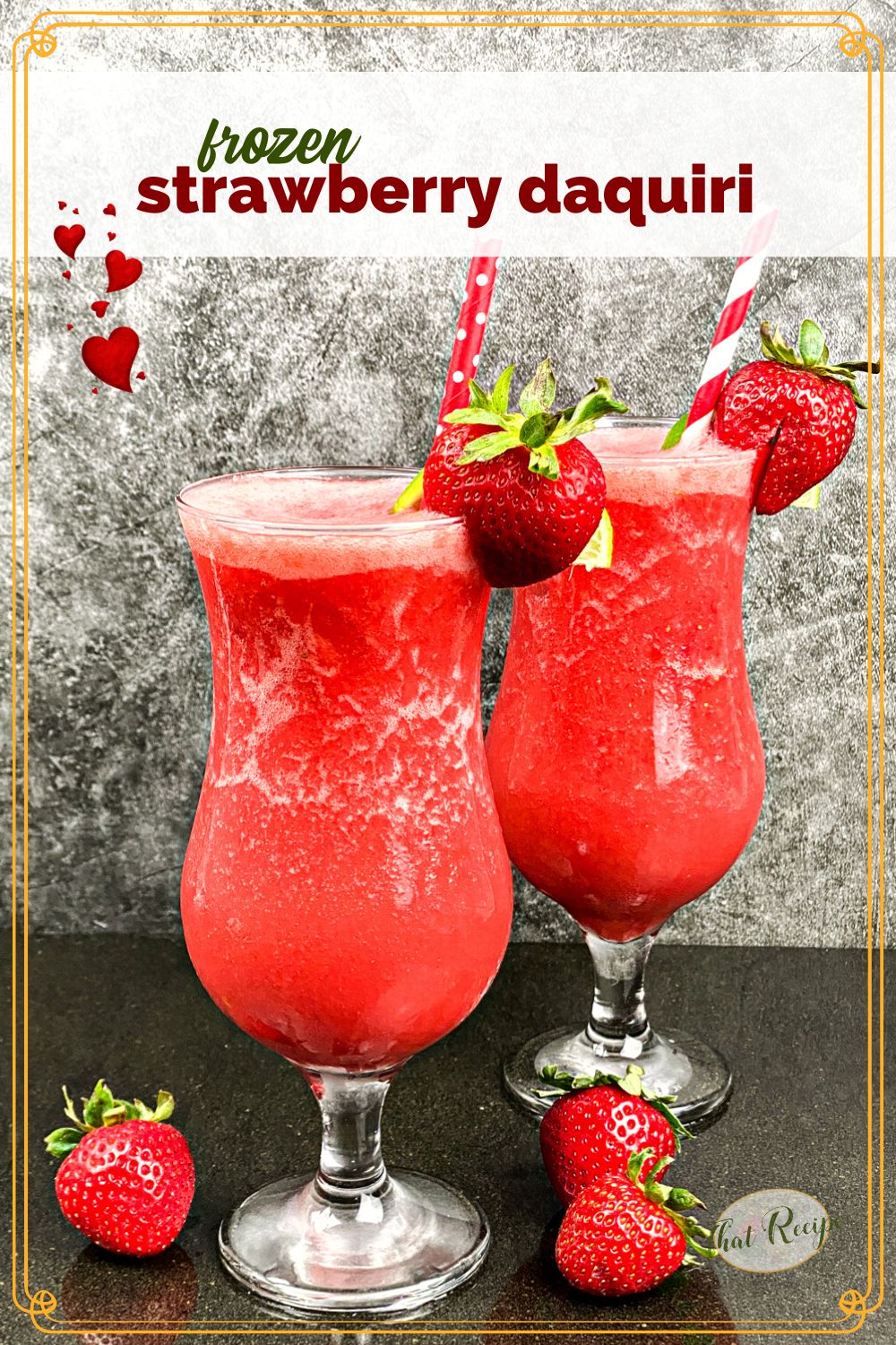 2 strawberry daiquiris in hurricane glasses with fresh strawberries